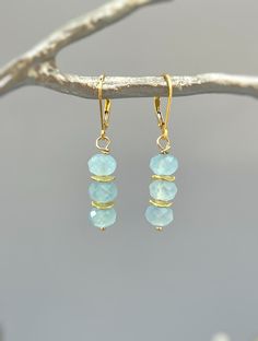 "Dainty handmade genuine aquamarine dangle earrings.  Lightweight earrings for women. Sparkling aquamarine blue gemstone rondelles hang from your choice of Sterling Silver, 14k gold Fill, or Rose Gold Fill French hook ear wires or leverbacks. Gemstone drops are dainty approx 1/4\" wide. Simple, elegant everyday earrings. These would make a lovely gift for mom or wife with a March birthday also something blue bridal earrings or bridesmaids gifts. Aquamarine size: approx 1/4\" wide Overall Earring