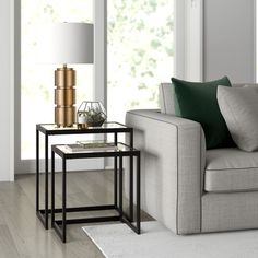 a living room scene with focus on the end table and sofa in the foreground