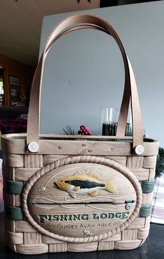 a fishing lodge basket sitting on top of a counter