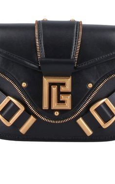 The Balmain Blaze Leather Shoulder Bag in black boasts an adjustable top leather shoulder strap for added convenience, secured with a snap flap closure. Its gold flap logo and double buckle detail on the front add a touch of sophistication. Plus, the bag features a flat back pocket and interior flat pocket within the spacious main compartment. Size and fit: H 6"/15cm X L 9"/23cm X D 2.75"/7 cmStrap span: 24.9"/63 cmComposition: 100% Calfskin LeatherHardware: Golden metalSignature dust bag includ Gold Travel Bags With Logo Hardware, Gold Shoulder Bag With Logo Hardware For Travel, Evening Flap Shoulder Bag With Brass Hardware, Evening Shoulder Flap Bag With Brass Hardware, Gold Business Bags With Brass Hardware, Luxury Shoulder Bag With Metal Logo, Designer Shoulder Bag With Brass Hardware, Designer Crossbody Shoulder Bag With Brass Hardware, Gold Crossbody Bag With Logo Hardware