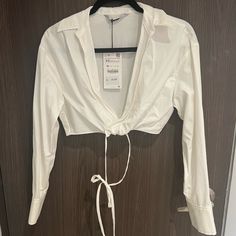 Zara White Crop Shirt Nwt!!! Size: X-Small White Fitted Cropped Shirt Chic Style, Chic Fitted White Cropped Shirt, Chic White Fitted Cropped Shirt, Chic White Cropped Shirt For Day Out, White Long Sleeve Cropped Shirt For Day Out, Chic White Cropped Shirt, Chic Zara Cotton Shirt, White Collared Top For Brunch, Chic White Zara Shirt