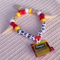 Silly little tooth bracelet because I opened this mini Orajel package from a minibrands ball. I made the teeth with Sculpey clay.  Bead Colors: red, white, yellow, clear, glitter, handmade Sculpey clay tooth charms Measurements: 17 - 22.5 cm  The length measurement is of the circumference of the bracelet. The first number is the inner circumference, the second is the outer circumference. All bracelets are stretchy and size my vary slightly due to the elastic stretch. Clay Tooth, Tooth Bracelet, Tooth Charm, Sculpey Clay, Kandi Bracelets, Length Measurement, Clay Bead, Sweet Tooth, Jewelry Bracelets