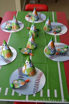 a table topped with paper hats and plates