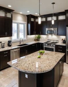 a large kitchen with granite counter tops and dark wood cabinets, along with stainless steel appliances