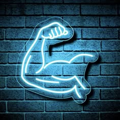 a neon sign that is on the side of a brick wall with a blue light