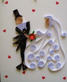 a wedding card made out of buttons and paper with a bride's dress on it