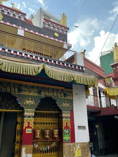 an ornately decorated building on the corner of a street