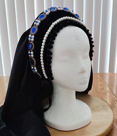 This headpiece is a perfect compliment to any dress and has been made to coordinate with my gold tone brass necklaces.  It is believed that Henry VIII's second wife and Elizabeth I's mother, Anne Boleyn brought the Hood style of headwear back to England following her service at the court of the French King.  This traditional example of an elaborate French Hood circa 1520 - 1540 and has been made from a sturdy base that has been covered with lush black velvet.   Appropriate weight wire has been a Medieval Crown Style Festival Headpiece, Medieval Crown Headpiece For Festival, Medieval Festival Crown Headpieces, Handmade Crown Headpiece For Costume, Handmade Tall Crown Headpiece For Costume Party, Handmade Tall Crown For Costume Party, Fantasy Costume Headpiece With Pinched Crown, Adjustable High Crown Headpiece For Costumes, Adjustable Tall Crown Headpiece For Cosplay