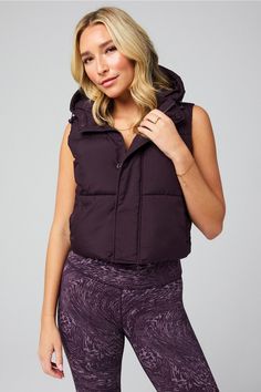 Essential Cropped Hooded Puffer Vest Fabletics purple female Activewear >> Womens >> Jackets & Outerwear >> Jackets regular Everyday Hidden Pockets/Reflective/Water-Resistant Cropped Puffer Vest, Hooded Puffer Vest, Female Activewear, Suede Fringe Jacket, Grey Vest, Sweater Trends, Womens Jackets, Reformation Dress, Wrap Sweater