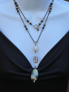 Light Blue/Tan/Black Agate Nugget, smokey quartz, white howlite round focal pendant on tiny black seed beads, Black,brown, clear crystals. Necklace is 44" Crystals Necklace, White Howlite, Black Seed, Black Agate, Clear Crystals, Smokey Quartz, Atlanta Ga, Clear Crystal, Beaded Necklaces