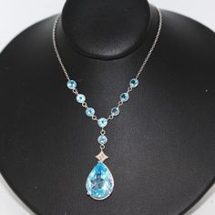 ⚓14k White Gold Pear Shaped Blue Topaz Lariat Necklace with Accented Topaz Chain Solid white gold, stamped 14k. Not filled, hollow or plated.  We sell the highest quality vintage items. Like-new condition! Free domestic shipping always! On its way to you in 1 business day.  30 day return policy!  ⚓The Details 8 round Blue Topaz Pear Shaped Blue Topaz approximate 7 ct wt 4.8 grams 16 inch chain ⚓Who We Are  We are a small, family-owned business in Plymouth, MA. Located in the heart of Main Street, Main Street Jewelry Co.'s mission is to find one-of-a-kind, unique pieces. Vintage, antiques, and rare finds are our specialty, of course other than our brand new Italian silver chains with a price that can't be beat. We thank you for supporting small businesses everywhere and checking out our sho Blue Topaz Teardrop Necklace For Formal Occasions, Formal Blue Topaz Teardrop Necklace, Formal Teardrop Blue Topaz Necklace, Formal Blue Topaz Drop Necklace, Formal Blue Topaz Teardrop Pendant Necklace, Formal Blue Topaz Briolette Necklace, Blue Topaz Pear-shaped Necklace, Elegant Blue Sterling Silver Lariat Necklace, Blue Pear-shaped Blue Topaz Necklace