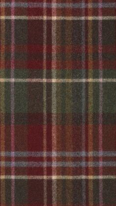 a plaid fabric with red, green and brown colors on it's side seamlessly