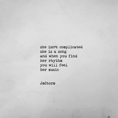 an old black and white photo with the quote she isn't complicated, she is a song and when you find her why