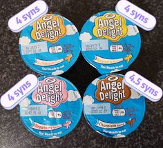 four angel delight candys sitting on top of a table