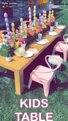 kids table with chairs and flowers on it