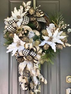 a wreath on the front door decorated with flowers