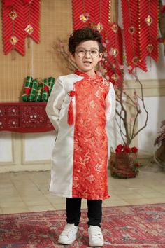 Pre-Made Boy Vietnamese Ao Dai (áo dài bé trai), Kids Vietnamese traditional dress, cheongsam, qipao Color: RED Ao Dai does not include pants Kid's Size Measurements SizeWeight (kg/lb) length (cm) width (cm) 110-12/22-26.5 46 60 212-14/26.5-30.9 48 63 314-16/30.9-35.3 50 65 416-18/35.3-39.7 52 68 518-20/39.7-44.1 54 70 620-22/44.1-48.5 56 73 722-24/48.5-52.9 58 75 824-27/52.9-59.5 60 78 927-30/59.5-66.1 62 80 1030-35/66.1-77.2 64 83 1235-39/77.2-86 68 87 1439-43/86-94.8 72 92 1643-46/94.8-101.4 Traditional White Cheongsam With Stand Collar, Traditional White Ao Dai For Party, White Ao Dai For Festive Occasions, Traditional White Long Sleeve Cheongsam, Traditional Cheongsam For Spring Festivals, Traditional Spring Festival Cheongsam, Spring Festival Traditional Cheongsam, Traditional Festive Spring Cheongsam, Spring Festive Traditional Cheongsam