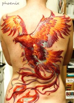 the back of a woman's body with an orange and red bird on it