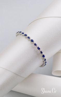 Stunning sapphires are perfect for any occasion. This shimmering bracelet features 28 stunning oval traditional blue sapphires surrounded by 336 round diamonds. Crafted from quality 14k white gold, this contemporary 7″ bracelet is secured with a safety clasp for added security. This bracelet measures approximately 1/4″ wide. Article number: 41083554 Elegant Sapphire Bracelets With Brilliant Cut, Elegant Sapphire Bracelet With Brilliant Cut, Classic Sapphire Diamond Bracelet With Brilliant Cut, Formal Sapphire Diamond Jubilee Bracelet, White Gold Sapphire Bracelet In Fine Jewelry Style, White Gold Sapphire Jubilee Bracelet, Elegant Sapphire Tennis Bracelet With Brilliant Cut, Sapphire Brilliant Cut Diamond Bracelet, Elegant Sapphire Diamond Bracelet With Brilliant Cut