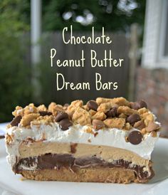 a piece of chocolate peanut butter dream bars on a white plate with the words chocolate peanut butter dream bars above it