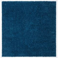 a blue area rug with white border