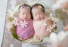 two newborn babies are wrapped in pink blankets