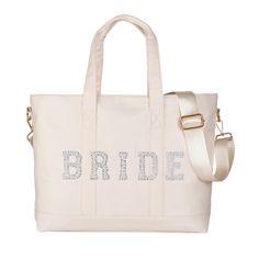 the bride tote bag is white and has silver sequins on the side