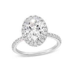 an oval cut diamond ring with pave set shoulders