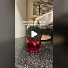 a bottle filled with liquid sitting on top of a counter