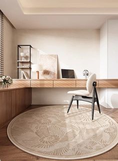 a white chair sitting on top of a rug in front of a wooden desk and shelves