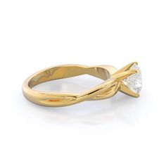 a yellow gold ring with a single diamond in the center and a twisted band around it