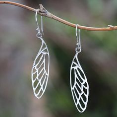 Displaying the complex veins of dragonfly wings these dangle earrings are crafted from high-polish sterling silver. Balinese artisan Budiharta creates these earrings which are realized with openwork patterns. Dragonfly Wings, Gem Earrings, Silver Dangle Earrings, Sterling Silver Dangle Earrings, Women's Slippers, Balinese, Silver Earrings Dangle, Jewelry Packaging, Hook Earrings