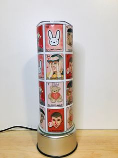 a tin can with pictures of people on it