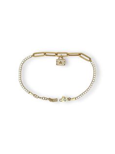 14k Real Gold Cubic Zirconia Tennis Paperclip Bracelet | 14KT Gold Plated Luxury Gifts for Her Introducing our exquisite 14K Real Gold Cubic Zirconia Tennis Paperclip Bracelet, a perfect blend of modern elegance and timeless luxury. Crafted with genuine 14K gold plating, this bracelet is a stunning accessory that will captivate any woman's heart. Designed with meticulous attention to detail, this bracelet features a unique paperclip chain design, adding a contemporary twist to the classic tennis bracelet style. The delicate chain is adorned with dazzling cubic zirconia stones, carefully hand-set for maximum brilliance and sparkle. The 14K gold plating adds a touch of opulence and sophistication, ensuring that this bracelet exudes a radiant glow that will turn heads. The gold plating also p Luxury Gold Diamond Paperclip Bracelet, Gold Pave Setting Tennis Bracelet Gift, Gold Tennis Bracelet With Pave Setting As Gift, Cubic Zirconia Gold Bracelet With Pave Setting, Elegant Gold Diamond Paperclip Bracelet, Gold Tennis Bracelet With Rectangular Diamond Links, Gold Diamond Tennis Bracelet With Rectangular Links, Classic Gold Chain Bracelet With Pave Setting, Yellow Gold Cubic Zirconia Diamond Bracelet With Rectangular Links