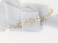 A classic and favorite among our brides, this crystal bracelet features tapering stones softly from the front to back. Each piece is handmade in the USA. DETAILS *As shown, the bracelet features crystal detailing throughout *Adjustable sizing *Finish is available in Silver or Gold, choose at checkout. The goal of your wedding accessories is to compliment your dress and your overall wedding day look, not overpower it. We want our products to make you feel beautiful and special on your wedding day Gold Bracelets With Handset Stones For Wedding, Wedding Cubic Zirconia Diamond Bracelet With Handset Stones, Wedding Diamond Bracelet With Handset Cubic Zirconia Stones, Adjustable Cubic Zirconia Crystal Bracelet For Wedding, Wedding Crystal Bracelets With Handset Stones, Wedding Crystal Bracelet With Handset Stones, Wedding Bracelets With Handset Crystal Stones, Crystal Bracelets With Handset Stones For Wedding, Handset Stone Crystal Bracelet For Weddings