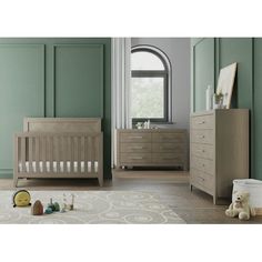 a baby's nursery room with green walls and furniture, including a crib