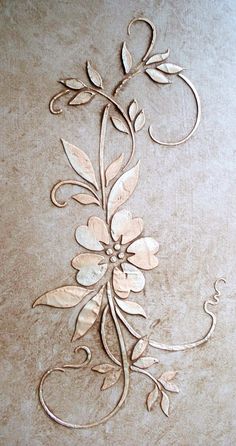 an intricately designed wall panel with flowers on it