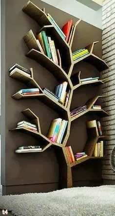 a tree shaped book shelf with books on it