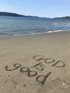 the words go good written in the sand at the beach