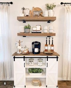 the shelves are filled with various items and dishes on top of them, along with coffee mugs