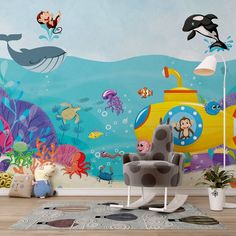 a child's room with an underwater scene painted on the wall