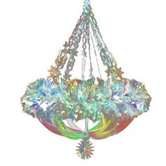 a multicolored chandelier hanging from the ceiling with stars and flowers on it