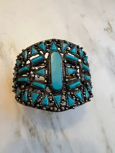 Vintage Navajo style faux turquoise cuff bracelet In excellent condition  Measures 2" at widest Western Style Blue Cuff Bangle Bracelet, Western Turquoise Bangle Cuff Bracelet, Western Style Turquoise Bangle Cuff Bracelet, Southwestern Style Bangle Cuff Bracelet For Festivals, Vintage Turquoise Cuff Bracelet For Festival, Turquoise Vintage Cuff Bracelet For Festival, Navajo Style, Turquoise Bracelet Cuff, Turquoise Cuff