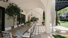 an outdoor dining area with tables and chairs