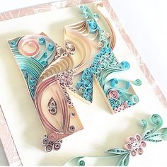 an intricately designed greeting card with the letter m