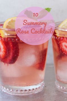 two glasses filled with ice and strawberries on top of a table next to each other