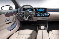 the interior of a mercedes s - class sedan with dashboard lights and steering wheel controls