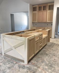 an unfinished kitchen is being built in the process of remodeling it's cabinets