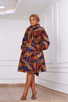 This Beautiful African print Ankara dress is so versatile. This dress is a must-have and can be worn for all types of occasions; to work, on a girl's day out, on date night or even to any of your events. The beautiful fit and flared cut accentuates any body type. Long Bubble sleeves. Zippered from neck to hemline, Zipper can be adjusted to any opening desired. Flared cut from waist to hemline. Detachable sash at the waist Functional side pockets. Beautiful bold and colorful prints make you stand Simple Ankara Dress Styles, Ankara Flare Gowns, Wrap Gowns, Bubu Gowns, Layered Hem Dress, Simple Dress Styles, Hand Dress, Afro Fashion, Ankara Dress Styles