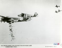 an old photo of two airplanes flying in the sky